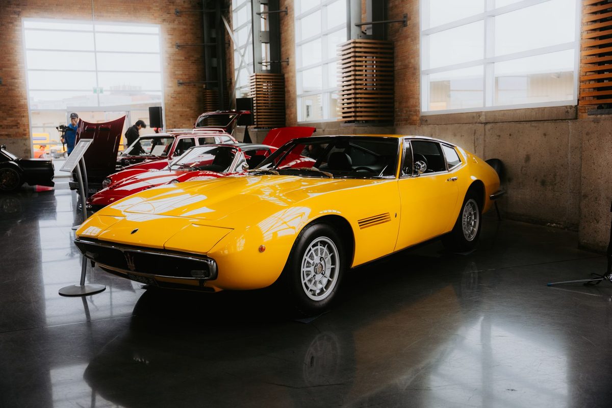 Classic car parked on a glossy dark coated garage floor