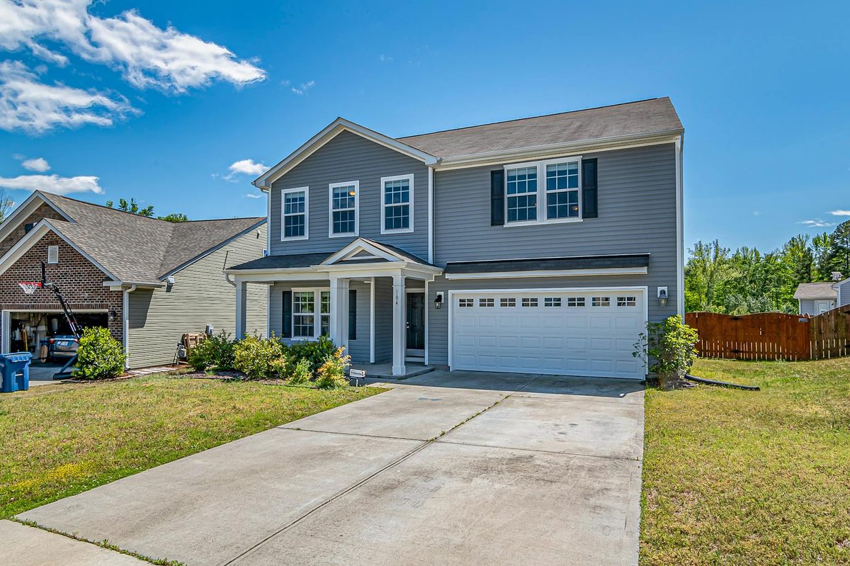 Two-story home with an attached two-car garage and driveway
